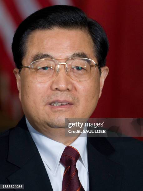 China's President Hu Jintao speaks during a meeting with US President Barack Obama at the Winfield House, the US Ambassador's residence in London, on...