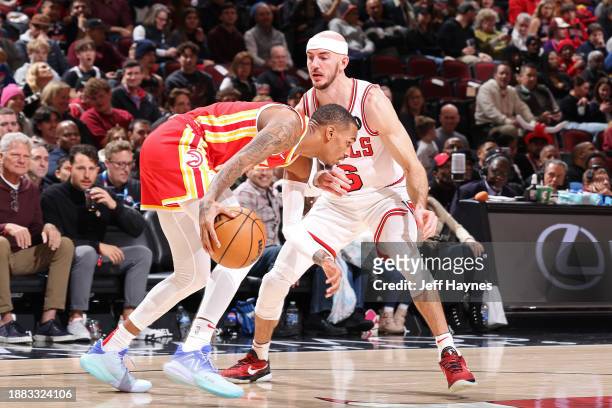 Alex Caruso of the Chicago Bulls plays defense against the Atlanta Hawks on December 26, 2023 at United Center in Chicago, Illinois. NOTE TO USER:...
