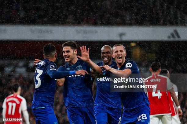 West Ham United's Greek defender Konstantinos Mavropanos celebrates after scoring his team second goal during the English Premier League football...