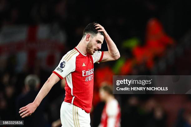 Arsenal's English midfielder Declan Rice reacts at the end of the English Premier League football match between Arsenal and West Ham at the Emirates...