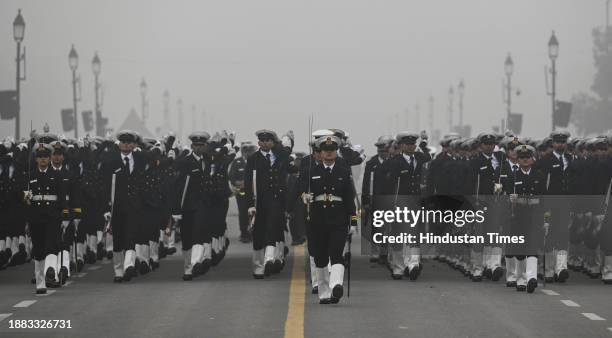 Indian coast guard personnel during rehearsals for the upcoming Republic Day parade amid fog on a cold winter morning on December 28, 2023 in New...