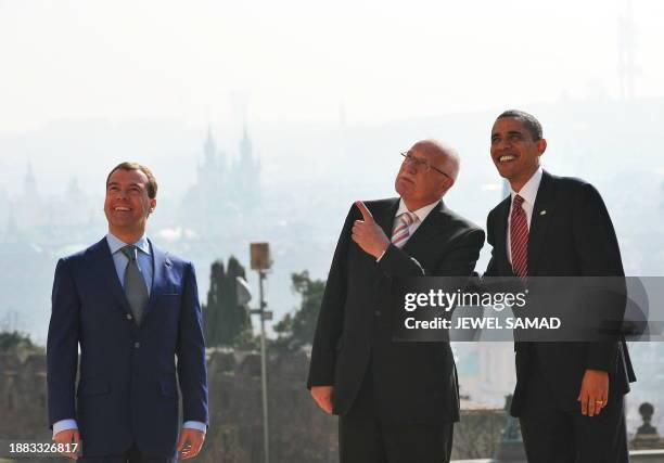 President Barack Obama poses for a family photo with his Czech counterpart Vaclav Klaus and Russian President Dmitry Medvedev at Prague Castle on...
