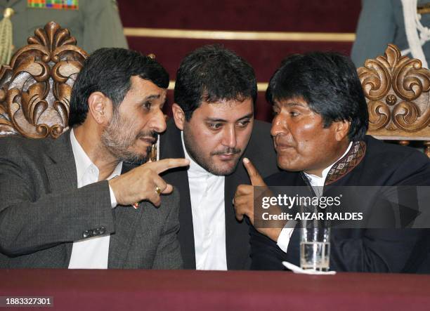 Bolivian President Evo Morales and Iran's Mahmoud Ahmadinejad converse November 24, 2009 at Palacio Quemado presidential palace in La Paz....