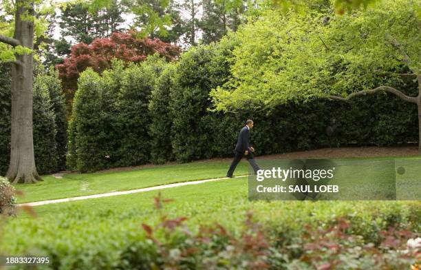 President Barack Obama walks to the Oval Office after arriving on Marine One on the South Lawn of the White House in Washington, DC, April 20, 2010....