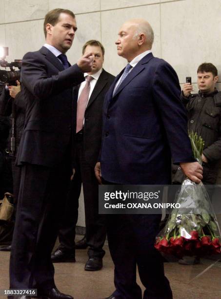 Russian President Dmitry Medvedev and Moscow Mayor Yuri Luzhkov speak as they inspect the site of the blast at the Lubyanka metro station in Moscow...