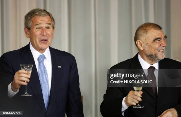 President George W. Bush exchange toasts with Croatian President Stipe Mesic during their joint dinner in Zagreb on April 4, 2008. Bush arrived in...