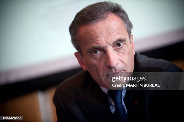 Picture taken on September 24, 2009 in Paris, shows then Veolia Environment head, Henri Proglio, holding a press conference. Proglio is to head...