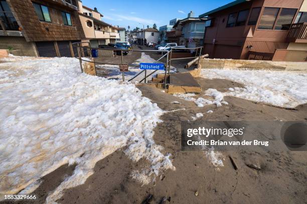 Ventura, CA Sand, water and foam inundated Pittsfield Lane in Pierpont after a seawall and sand berm was breached by high surf on Thursday, Dec. 28,...