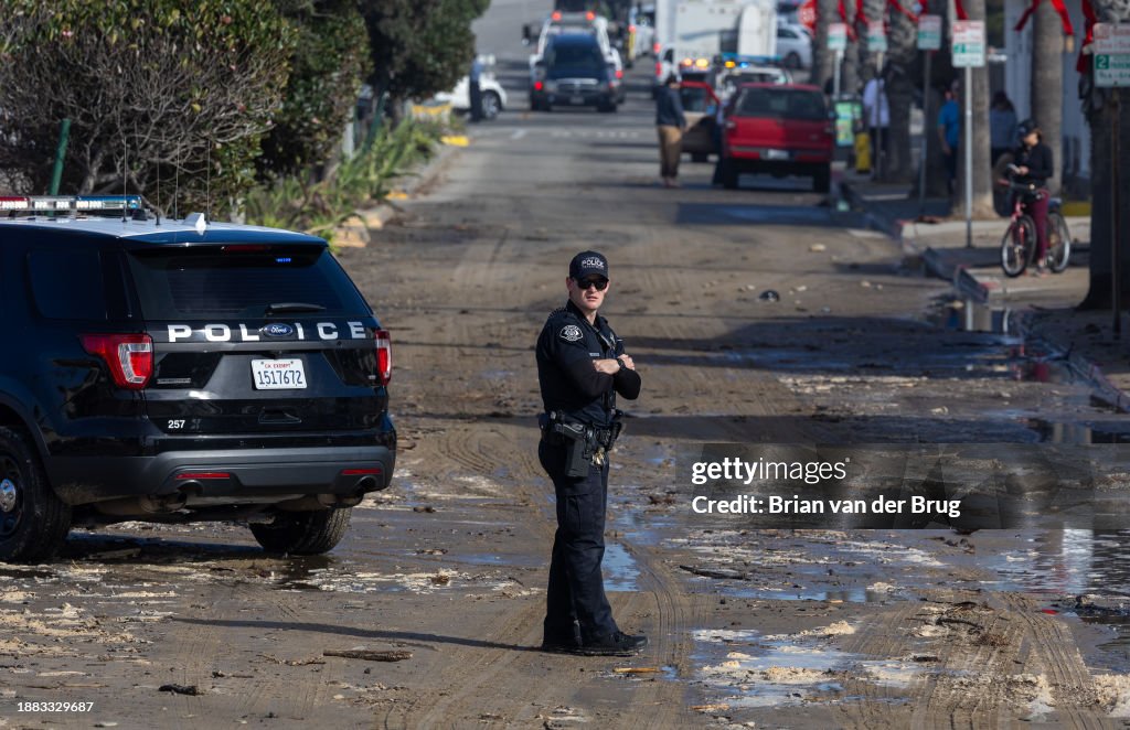 A Ventura police officer keeps watch as authorities closed the coastline