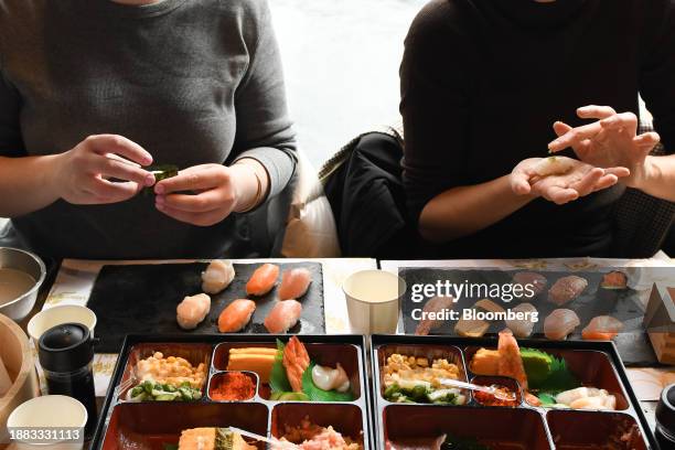 Foreign visitors learn how to make sushi in a cooking class at Sushi Making Tokyo in the Asakusa district of Tokyo, Japan, on Thursday, Dec. 28,...