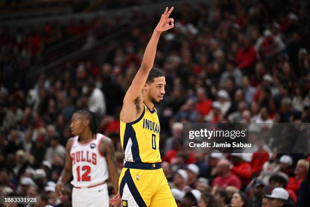 Tyrese Haliburton of the Indiana Pacers holds up three fingers after the Pacers made another three-point basket in the second half against the...