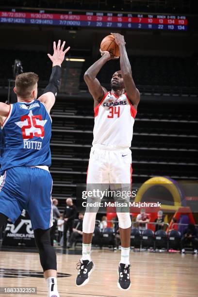 Dewayne Dedmon of the Ontario Clippers shoots the ball over Micah Potter of the Salt Lake City Stars during the game at the Delta Center on December...