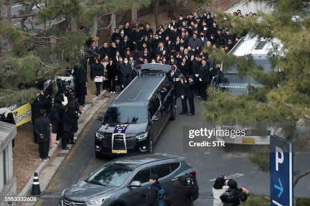 The hearse carrying the casket of late South Korean actor Lee Sun-kyun leaves a funeral hall after his funeral ceremony at the Seoul National...