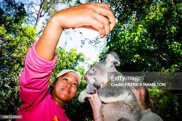 Japan's Naomi Osaka visits Lone Pine Koala Sanctuary ahead of the Brisbane International tennis tournament in Brisbane on December 29, 2023. / --...