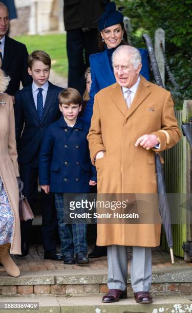 Prince George of Wales, Prince Louis of Wales, Catherine, Princess of Wales and King Charles III attend the Christmas Morning Service at Sandringham...
