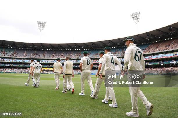 Australia players walk out onto the field for national anthems prior to day one of the Second Test Match between Australia and Pakistan at Melbourne...