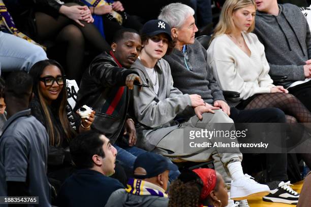 Rich Paul , Timothee Chalamet and his father Marc Chalamet attend a basketball game between the Los Angeles Lakers and the Boston Celtics at...