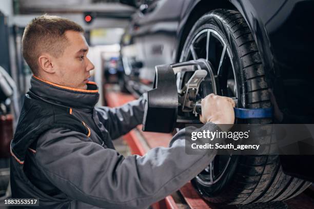 Mechanic Alignment Wheel Alignment And Balancing Photos and Premium High Res Pictures ...