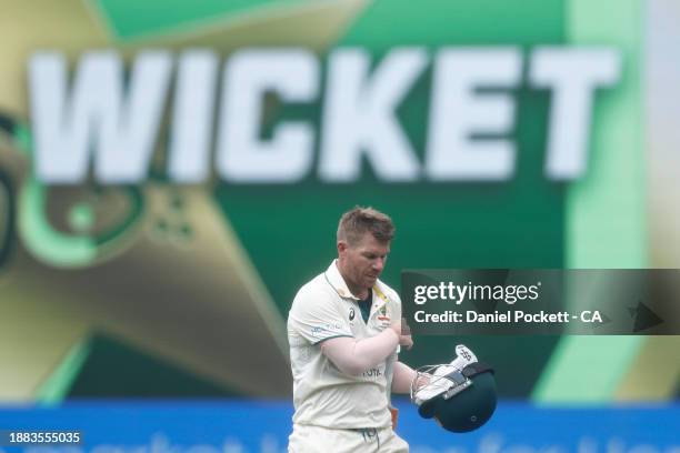 David Warner of Australia leaves the field after being dismissed by Salman Ali Agha of Pakistan during day one of the Second Test Match between...