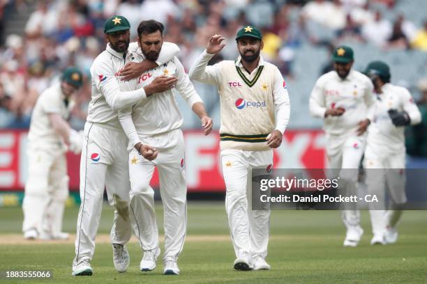 Salman Ali Agha of Pakistan celebrates the dismissal of David Warner of Australia during day one of the Second Test Match between Australia and...