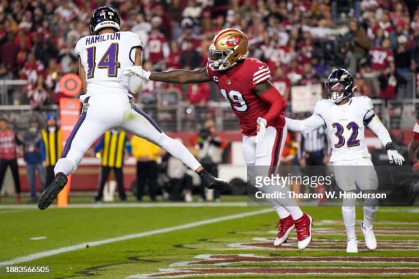 Kyle Hamilton of the Baltimore Ravens intercepts a pass intended for Deebo Samuel of the San Francisco 49ers during the first quarter at Levi's...