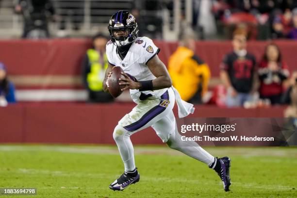 Lamar Jackson of the Baltimore Ravens runs the ball during the second quarter against the San Francisco 49ers at Levi's Stadium on December 25, 2023...