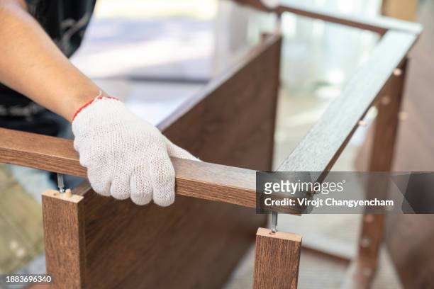 craftsmen with furniture wooden table at home - careerbuilder challenge stock pictures, royalty-free photos & images