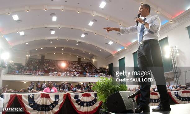 President Barack Obama answers a question during a town hall event on the economy at Racine Memorial Hall in Racine, Wisconsin, June 30, 2010. AFP...