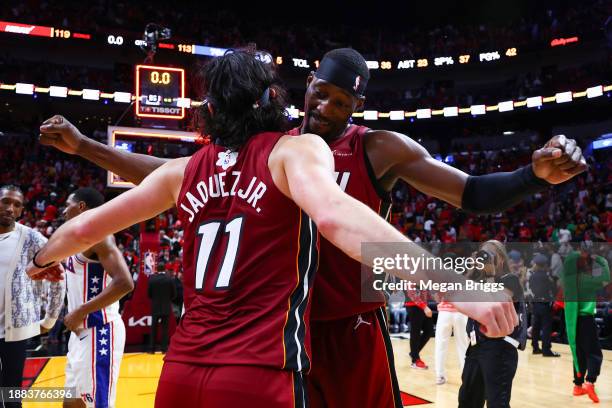 Jaime Jaquez Jr. #11 and Bam Adebayo of the Miami Heat celebrate after defeating the Philadelphia 76ers at Kaseya Center on December 25, 2023 in...