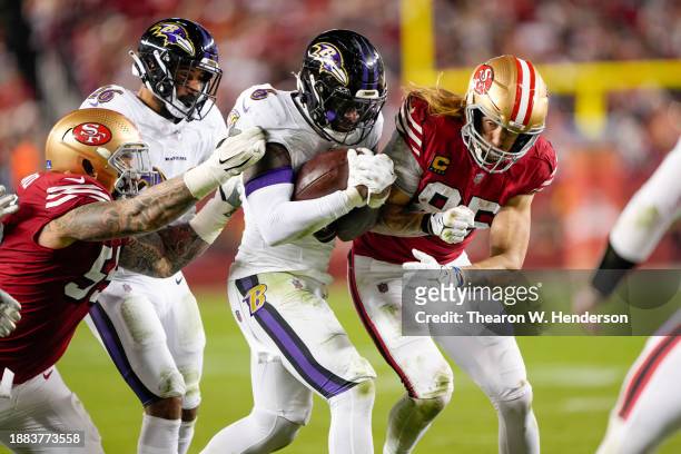 Patrick Queen of the Baltimore Ravens hits George Kittle of the San Francisco 49ers after Queen's interception during the third quarter at Levi's...