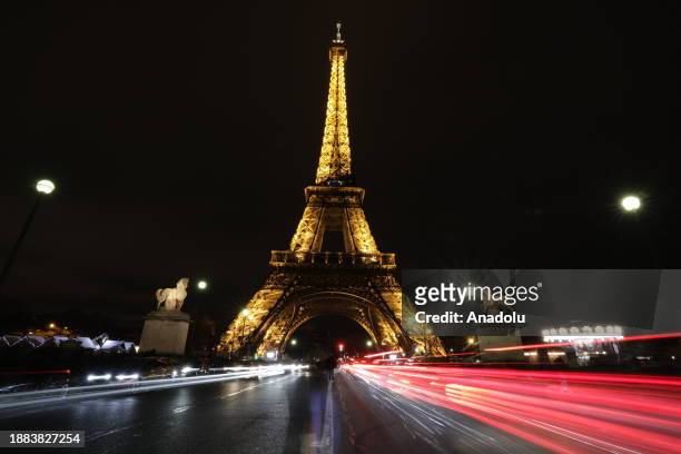 View of the Eiffel Tower near which a Christmas market is set up ahead of the New Year's eve in Paris, France on December 26, 2023.