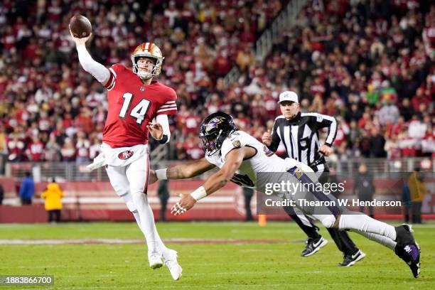 Malik Harrison of the Baltimore Ravens attempts to tackle Sam Darnold of the San Francisco 49ers as he attempts a pass during the fourth quarter at...