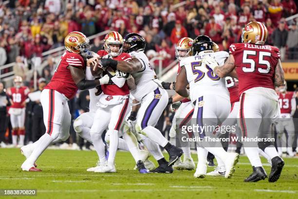 Travis Jones of the Baltimore Ravens sacks Sam Darnold of the San Francisco 49ers during the fourth quarter at Levi's Stadium on December 25, 2023 in...