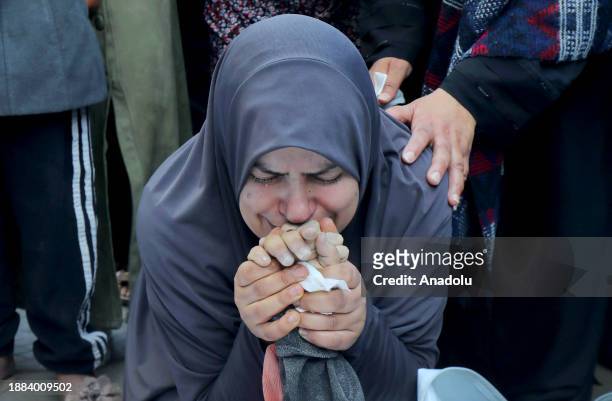 Palestinian mother Esma Zuhd cries after her children, Jahan and Ahmed Nasser who died after an Israeli attack at the Nuseirat Refugee Camp in Deir...