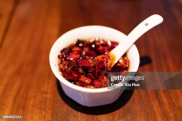 chili oil in the restaurant - chili oil stock pictures, royalty-free photos & images