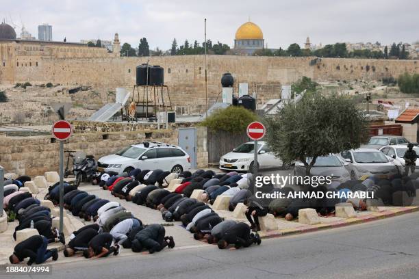 The Dome of the Rock mosque at the Al-Aqsa Mosque compound is seen as Palestinian Muslims gather for Friday prayers in east Jerusalem on December 29...