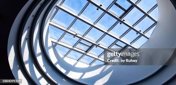 architectural detail of skylight with shadows and angled light inside a shopping center in valladolid, spain. - skylight stock pictures, royalty-free photos & images