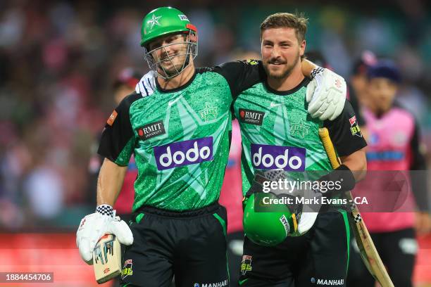 Hilton Cartwright of the Stars and Jonathan Merlo of the Stars come off after their win during the BBL match between Sydney Sixers and Melbourne...