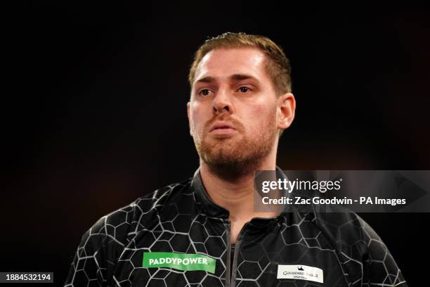 Berry van Peer in action against Damon Heta on day twelve of the Paddy Power World Darts Championship at Alexandra Palace, London. Picture date:...