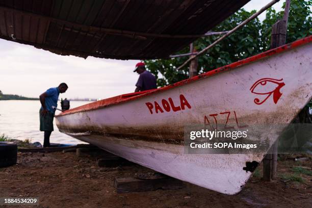 Fisherman is seen getting his boat ready before going out fishing. After being exploited for intense oil extraction for decades, Lake Maracaibo has...