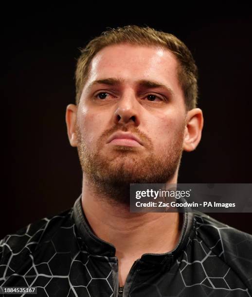 Berry van Peer in action against Damon Heta on day twelve of the Paddy Power World Darts Championship at Alexandra Palace, London. Picture date:...