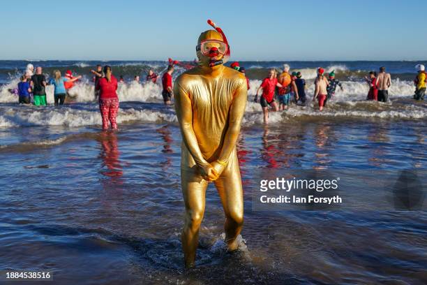 Bathers brave the cold waters of the North Sea as they take part in the annual Boxing Day dip at Redcar Beach on December 26, 2023 in Redcar,...