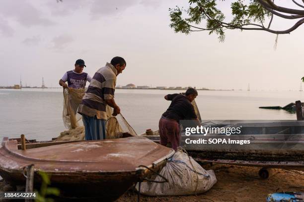 Fishermen are seen preparing their nets before fishing in Lake Maracaibo. After being exploited for intense oil extraction for decades, Lake...