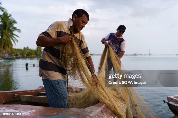 Fishermen are seen preparing their nets before fishing in Lake Maracaibo. After being exploited for intense oil extraction for decades, Lake...