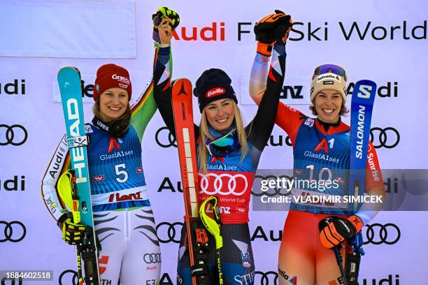 Winner US' Mikaela Shiffrin , runner-up Germany's Lena Duerr and third placed Switzerland's Michelle Gisin celebrate on the podium after the Women's...