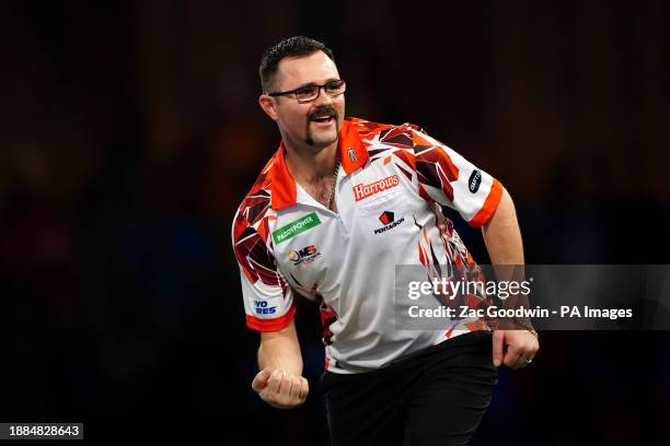 Damon Heta celebrates after beating Berry van Peer on day twelve of the Paddy Power World Darts Championship at Alexandra Palace, London. Picture...