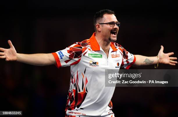 Damon Heta celebrates after beating Berry van Peer on day twelve of the Paddy Power World Darts Championship at Alexandra Palace, London. Picture...