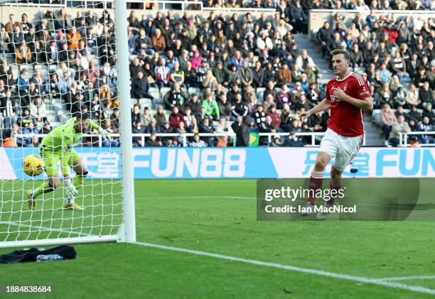 Chris Woods of Nottingham Forrest scores his team's opening goal during the Premier League match between Newcastle United and Nottingham Forest at...