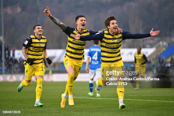 Adrian Bernabè and Dennis Man celebrate during the Serie B match between Brescia and Parma at Stadio Mario Rigamonti on December 26, 2023 in Brescia,...