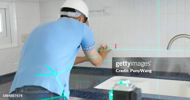 home inspector use laser level - spirit level stock pictures, royalty-free photos & images